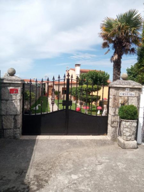Casa con jardín en primera línea de playa
